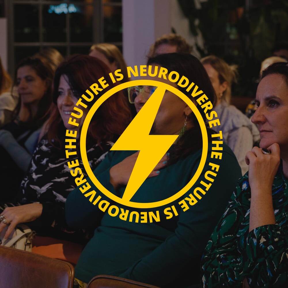 Audience at an ND event with an overlay of a bold yellow lightning bolt and circular text reading 'The Future is Neurodiverse.' The audience appears engaged, emphasising community and inclusivity.